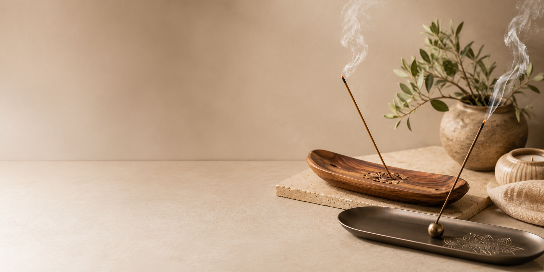 Wood vs metal incense holders comparison — wooden boat holder and metal tray with incense sticks burning